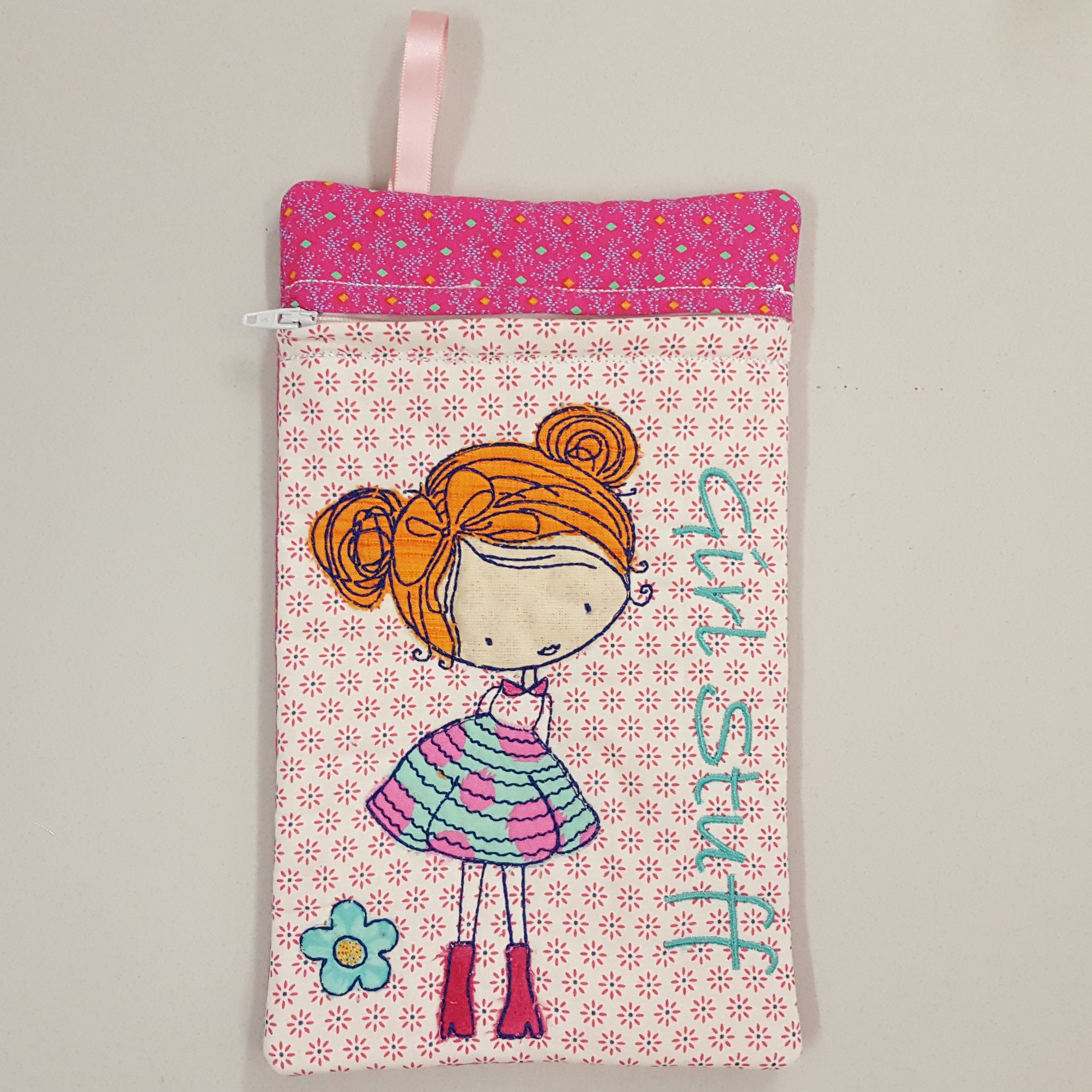 Small pouch with a cartoon girl design and 'girl stuff' text sweet pea ith design