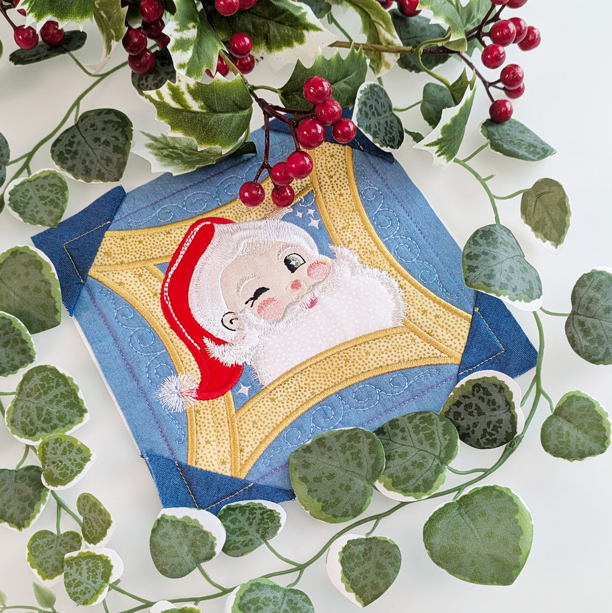 santa block in 2026 christmas bow styled with cranberries