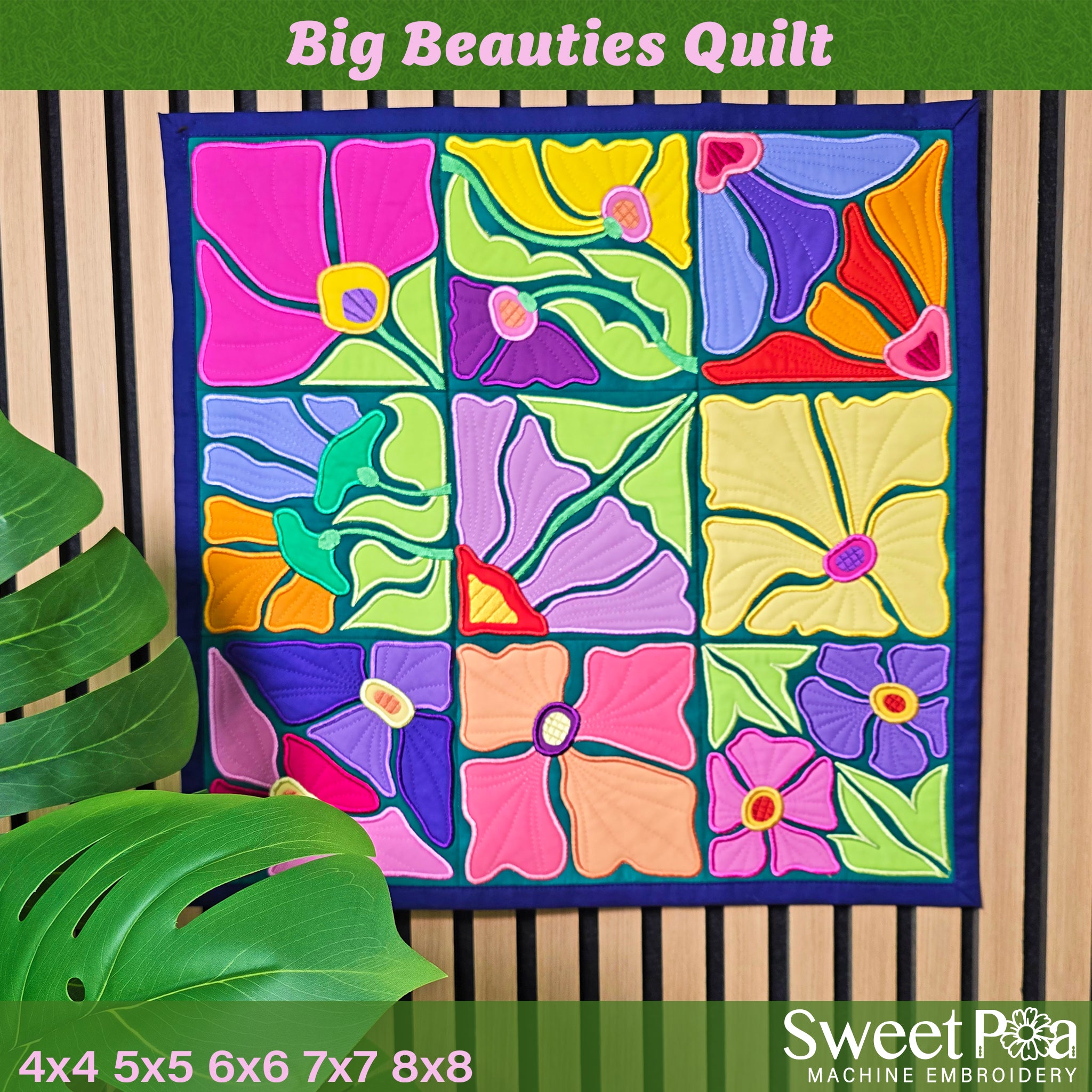 Colorful ITH quilt with floral patterns displayed against a wooden background, featuring the brand 'Sweet Pea Machine Embroidery'.