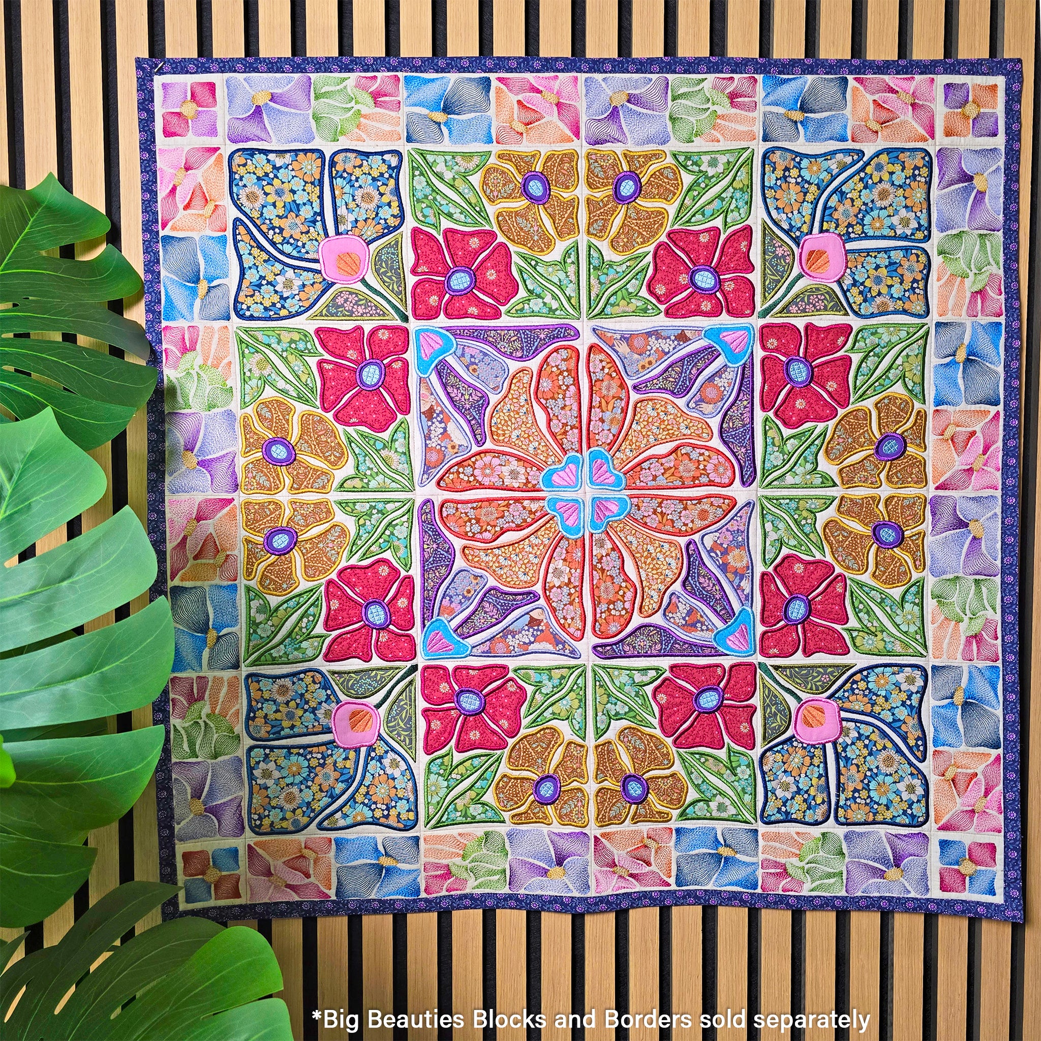 Colorful floral ITH quilt with a geometric pattern on a wooden background