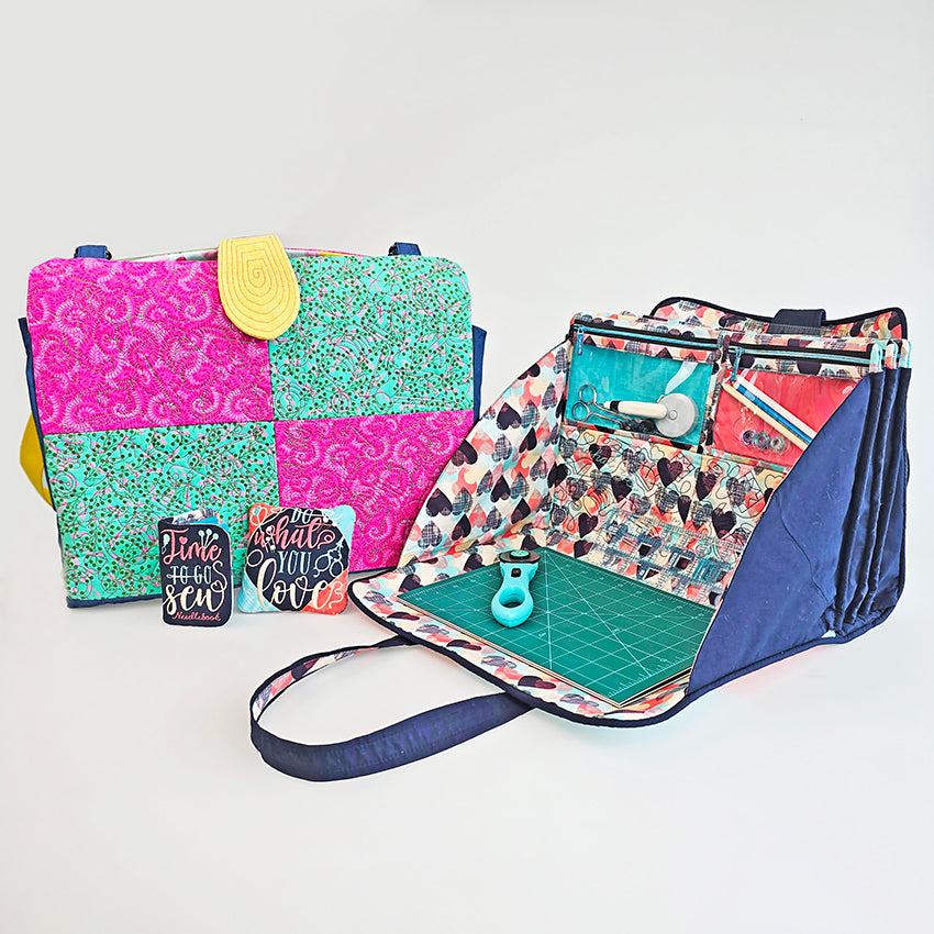 Colourful craft totes in two sizes with various compartments and accessories on a white background