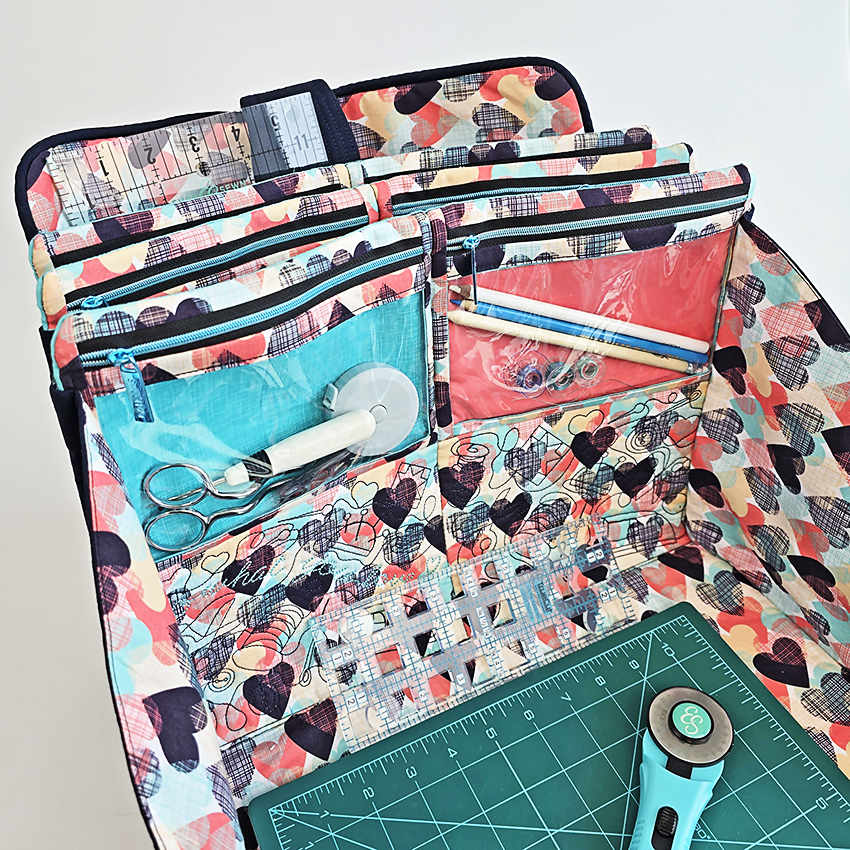 Colorful sewing kit with various tools on a white background