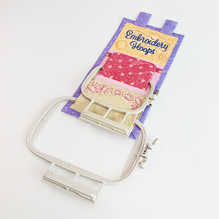 Embroidery hoop hanger with embroidery hoops in use