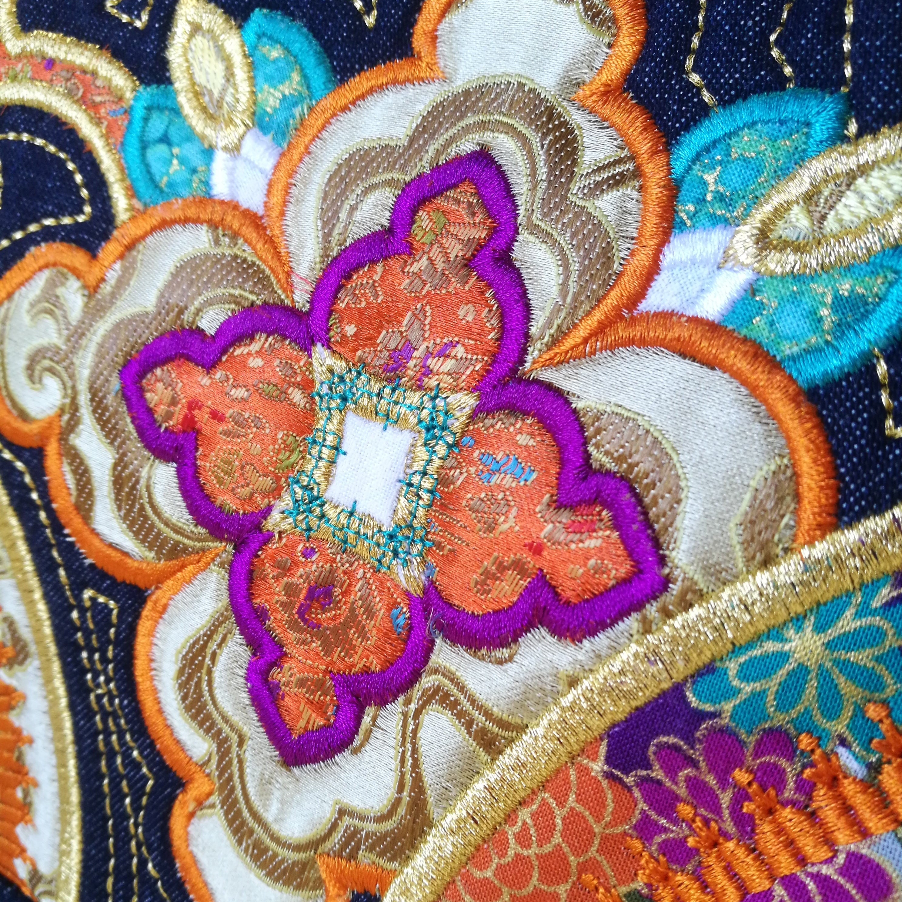 close up of applique and embroidery on japanese obi tote