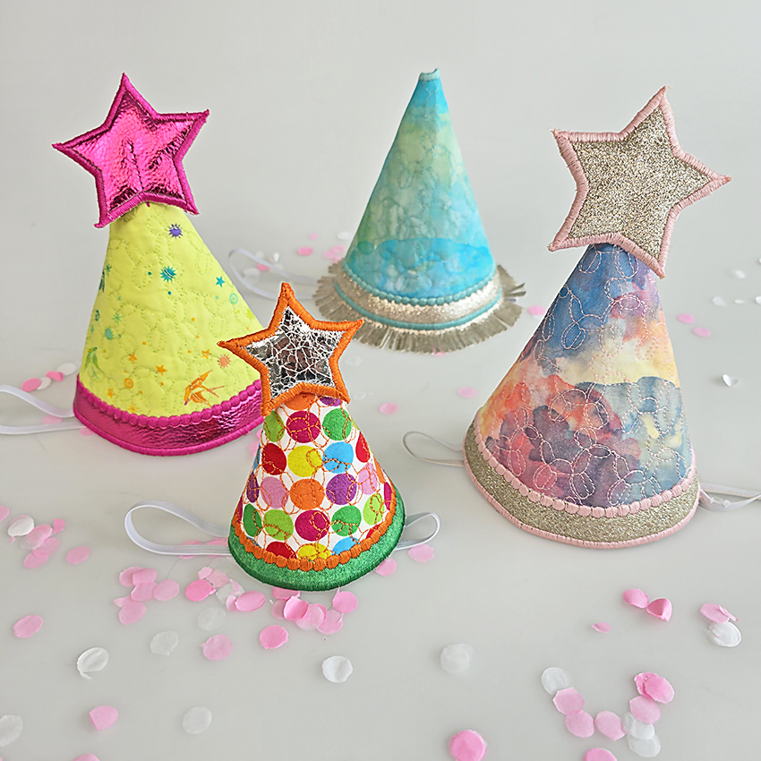 Colorful party hats with star and cone designs by sweet pea