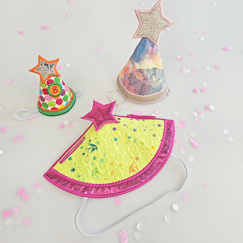 Colorful party hats with star designs made in the hoop