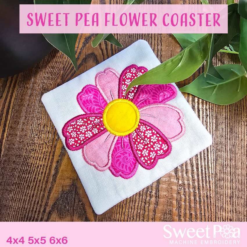 Floral coaster with pink flower design on a wooden surface, featuring 'Sweet Pea' branding