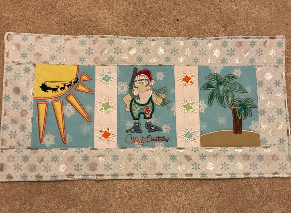 Summer Santa Table Runner 5x7 6x10 8x12 - Sweet Pea Australia In the hoop machine embroidery designs. in the hoop project, in the hoop embroidery designs, craft in the hoop project, diy in the hoop project, diy craft in the hoop project, in the hoop embroidery patterns, design in the hoop patterns, embroidery designs for in the hoop embroidery projects, best in the hoop machine embroidery designs perfect for all hoops and embroidery machines