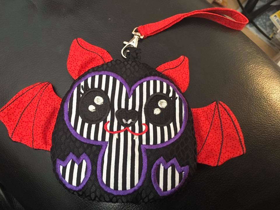 Vampire Bat Zipper Purse 4x4 5x5 - Sweet Pea Australia In the hoop machine embroidery designs. in the hoop project, in the hoop embroidery designs, craft in the hoop project, diy in the hoop project, diy craft in the hoop project, in the hoop embroidery patterns, design in the hoop patterns, embroidery designs for in the hoop embroidery projects, best in the hoop machine embroidery designs perfect for all hoops and embroidery machines