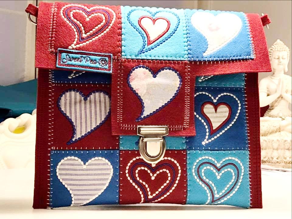 Heart Patchwork Bag 4x4 5x5 - Sweet Pea Australia In the hoop machine embroidery designs. in the hoop project, in the hoop embroidery designs, craft in the hoop project, diy in the hoop project, diy craft in the hoop project, in the hoop embroidery patterns, design in the hoop patterns, embroidery designs for in the hoop embroidery projects, best in the hoop machine embroidery designs perfect for all hoops and embroidery machines