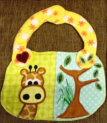 Giraffe Baby Bib ITH in the Hoop 5x7 - Sweet Pea Australia In the hoop machine embroidery designs. in the hoop project, in the hoop embroidery designs, craft in the hoop project, diy in the hoop project, diy craft in the hoop project, in the hoop embroidery patterns, design in the hoop patterns, embroidery designs for in the hoop embroidery projects, best in the hoop machine embroidery designs perfect for all hoops and embroidery machines