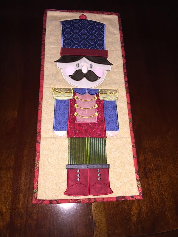 Nutcracker Table Runner 5x7 6x10 7x12 - Sweet Pea Australia In the hoop machine embroidery designs. in the hoop project, in the hoop embroidery designs, craft in the hoop project, diy in the hoop project, diy craft in the hoop project, in the hoop embroidery patterns, design in the hoop patterns, embroidery designs for in the hoop embroidery projects, best in the hoop machine embroidery designs perfect for all hoops and embroidery machines