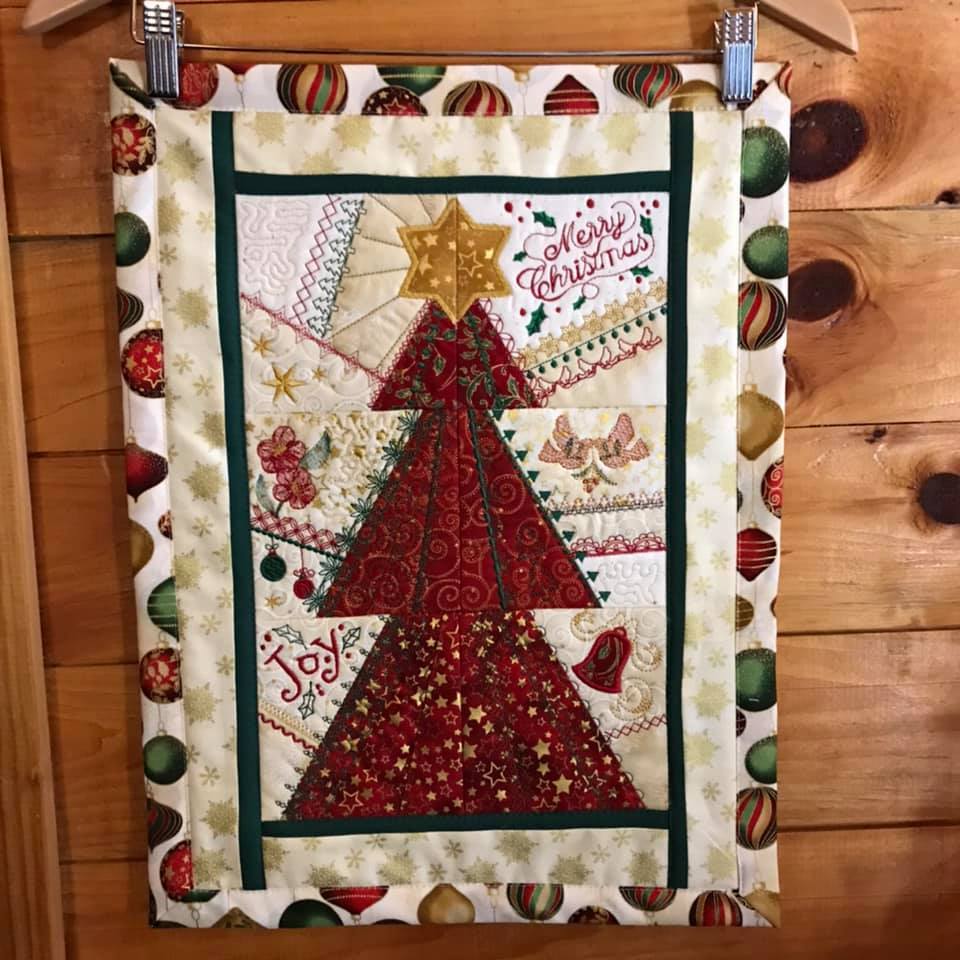 Patchwork Christmas Tree Wall Hanging / Runner 4x4 5x5 6x6 - Sweet Pea Australia In the hoop machine embroidery designs. in the hoop project, in the hoop embroidery designs, craft in the hoop project, diy in the hoop project, diy craft in the hoop project, in the hoop embroidery patterns, design in the hoop patterns, embroidery designs for in the hoop embroidery projects, best in the hoop machine embroidery designs perfect for all hoops and embroidery machines