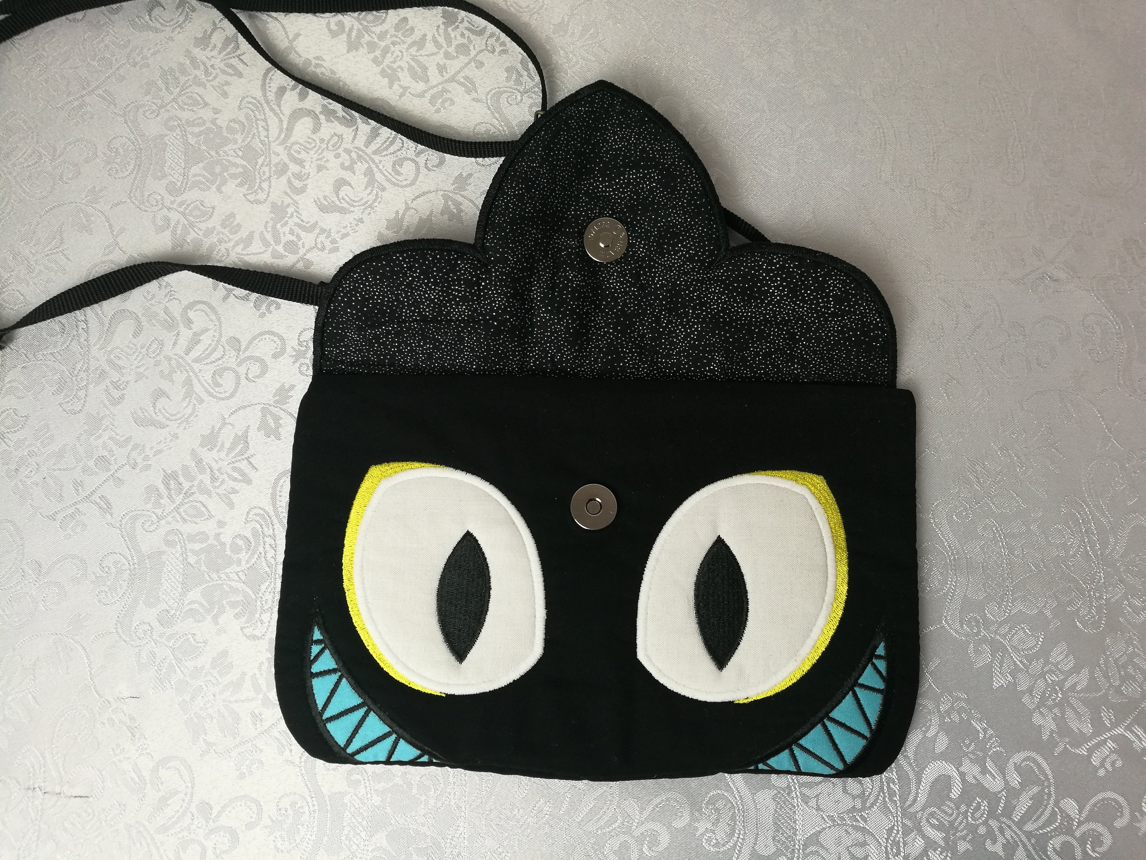 Evil Villain Clutch 5x7 6x10 7x12 - Sweet Pea Australia In the hoop machine embroidery designs. in the hoop project, in the hoop embroidery designs, craft in the hoop project, diy in the hoop project, diy craft in the hoop project, in the hoop embroidery patterns, design in the hoop patterns, embroidery designs for in the hoop embroidery projects, best in the hoop machine embroidery designs perfect for all hoops and embroidery machines