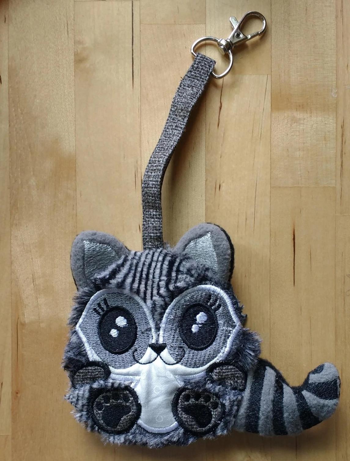 Raccoon Zipper Purse 4x4 5x5 - Sweet Pea Australia In the hoop machine embroidery designs. in the hoop project, in the hoop embroidery designs, craft in the hoop project, diy in the hoop project, diy craft in the hoop project, in the hoop embroidery patterns, design in the hoop patterns, embroidery designs for in the hoop embroidery projects, best in the hoop machine embroidery designs perfect for all hoops and embroidery machines