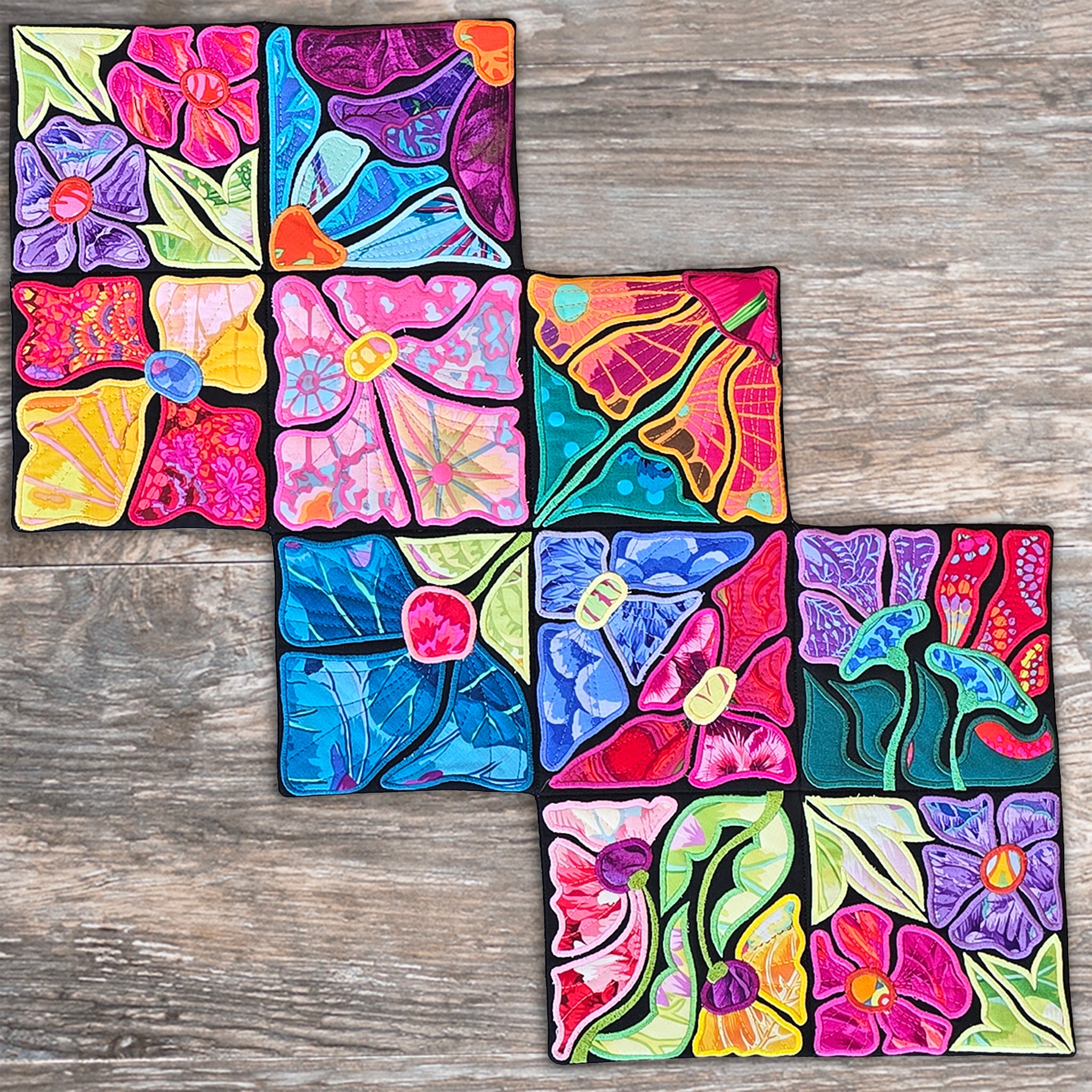 Colorful floral ITH table runner on a wooden surface