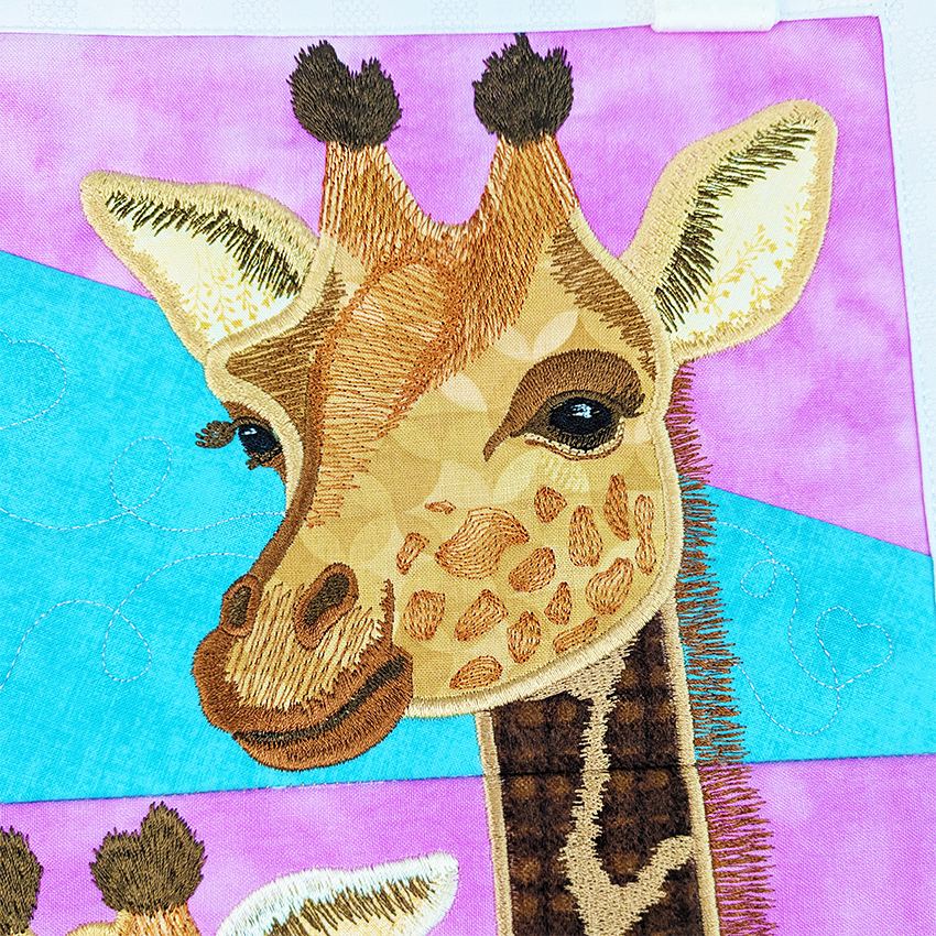 Giraffe Hanger In The Hoop plus Sweet Pea threads close up 3