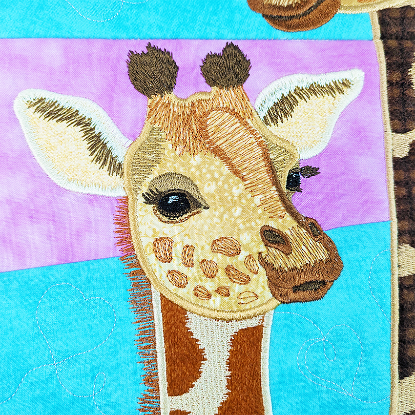 Giraffe Hanger In The Hoop plus Sweet Pea threads close up 2