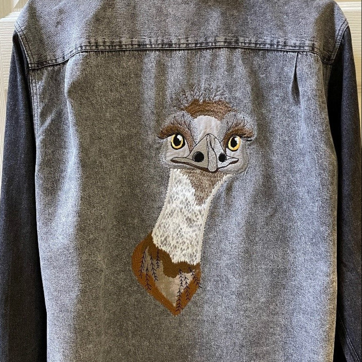 Denim jacket with an embroidered emu face by Karla