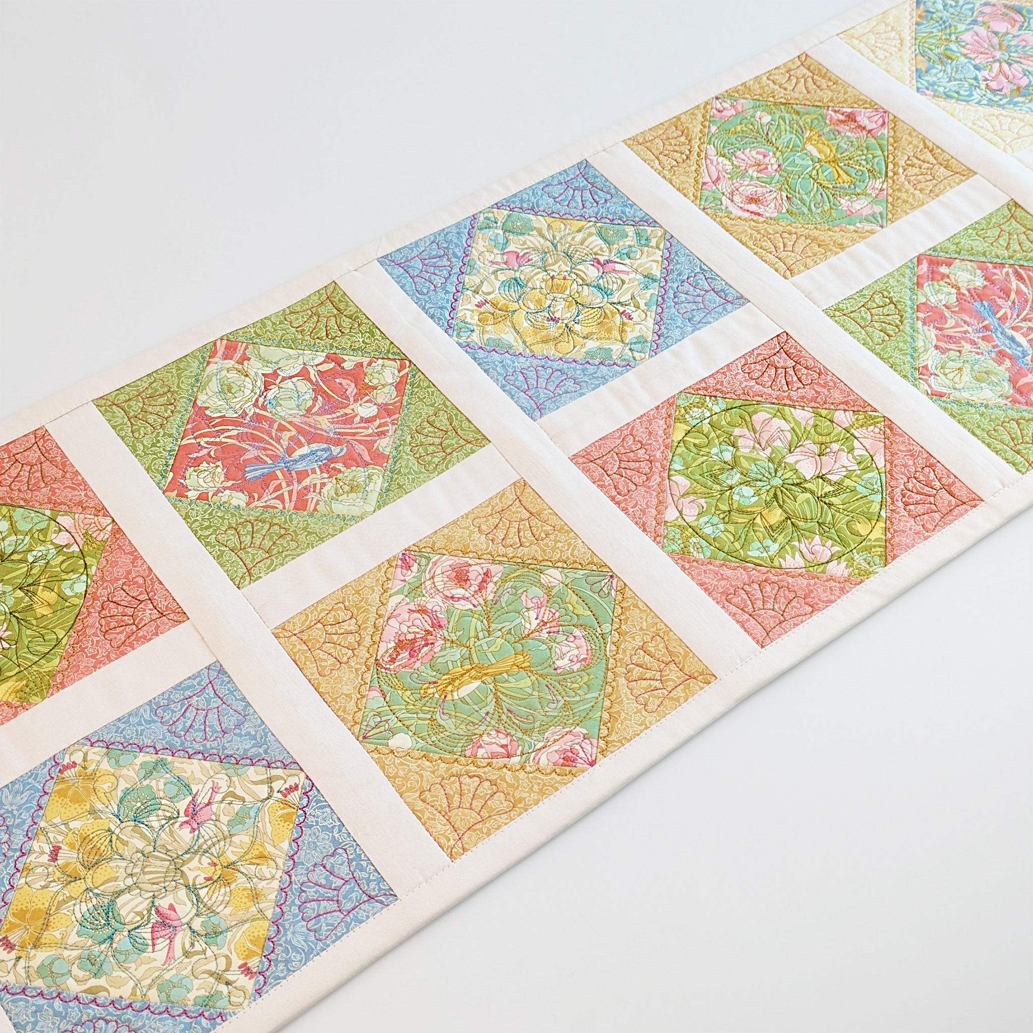 Mandala Quilt As You Go In the hoop machine embroidery design as a runner with patterned fabric