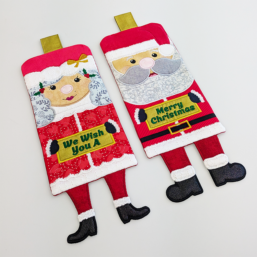 Mr and Mrs Claus legs freestanding with signs 