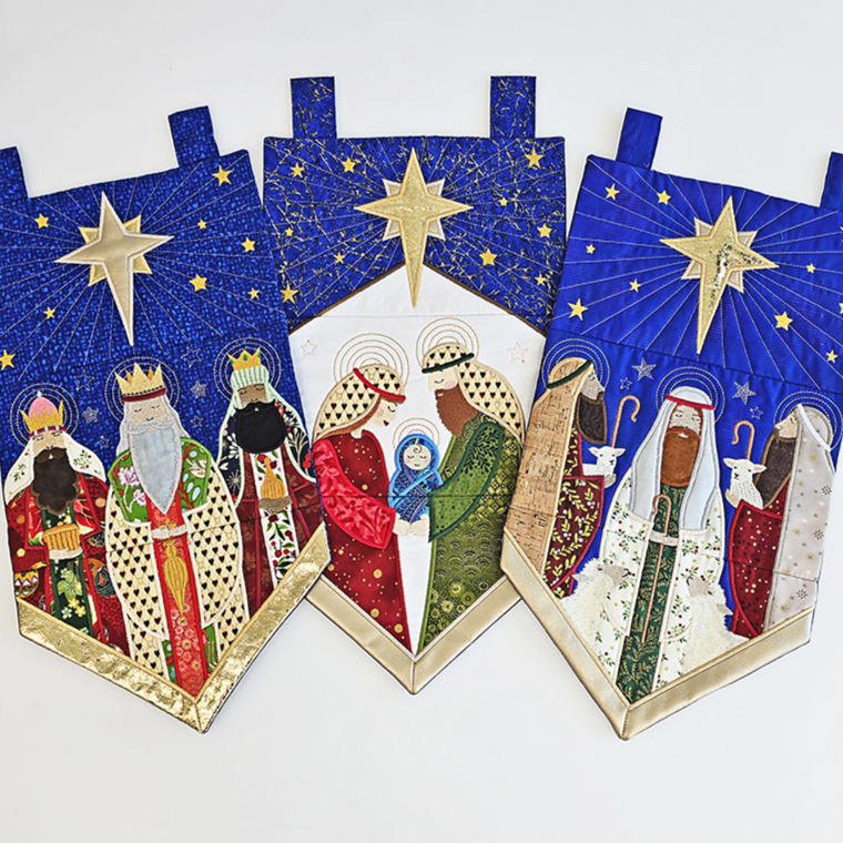 Three nativity scene wall hangings with the Three Wise Men, baby Jesus, Three Shepherds all by Sweet Pea close up