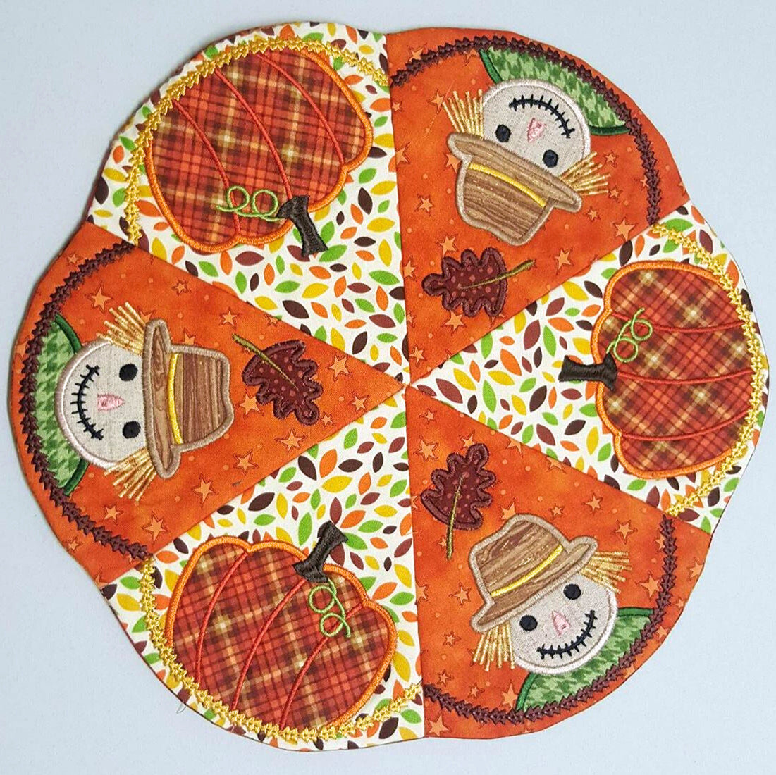 scarecrow and pumpkin ith table centre by sweet pea