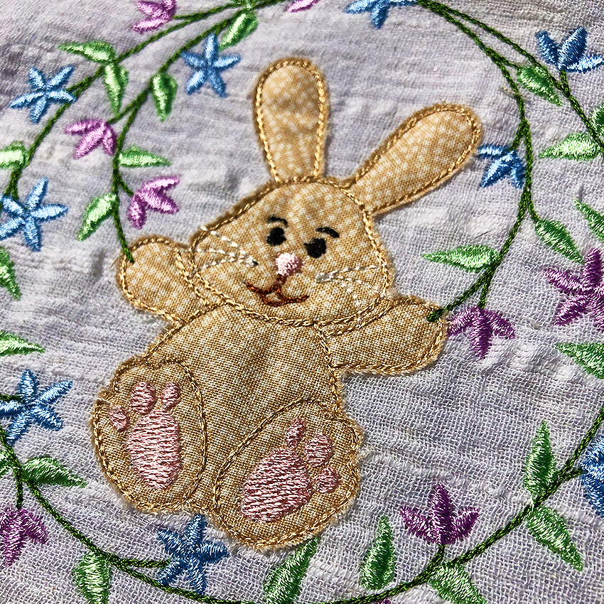 Bunny with Floral Border Applique Design 4x4 5x5 6x6 7x7 - Sweet Pea Australia In the hoop machine embroidery designs. in the hoop project, in the hoop embroidery designs, craft in the hoop project, diy in the hoop project, diy craft in the hoop project, in the hoop embroidery patterns, design in the hoop patterns, embroidery designs for in the hoop embroidery projects, best in the hoop machine embroidery designs perfect for all hoops and embroidery machines