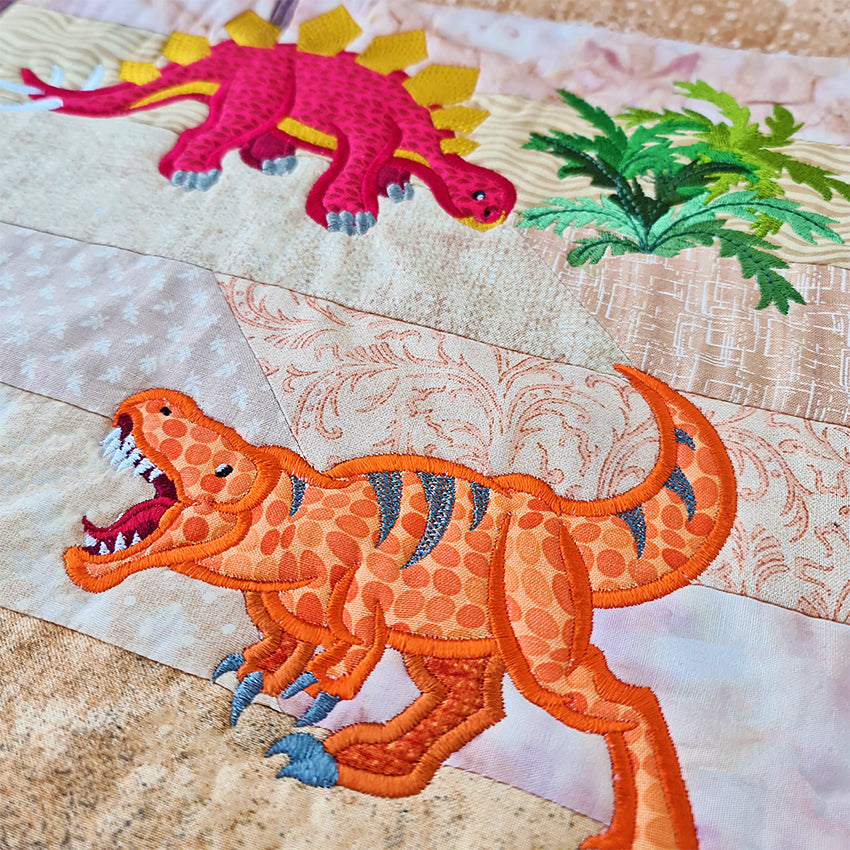 Dinosaur in the Cretaceous (Floating) Quilt 5x7 - Sweet Pea Australia In the hoop machine embroidery designs. in the hoop project, in the hoop embroidery designs, craft in the hoop project, diy in the hoop project, diy craft in the hoop project, in the hoop embroidery patterns, design in the hoop patterns, embroidery designs for in the hoop embroidery projects, best in the hoop machine embroidery designs perfect for all hoops and embroidery machines