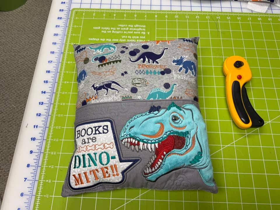 Dinosaur Reading Pillow in the hoop machine embroidery design