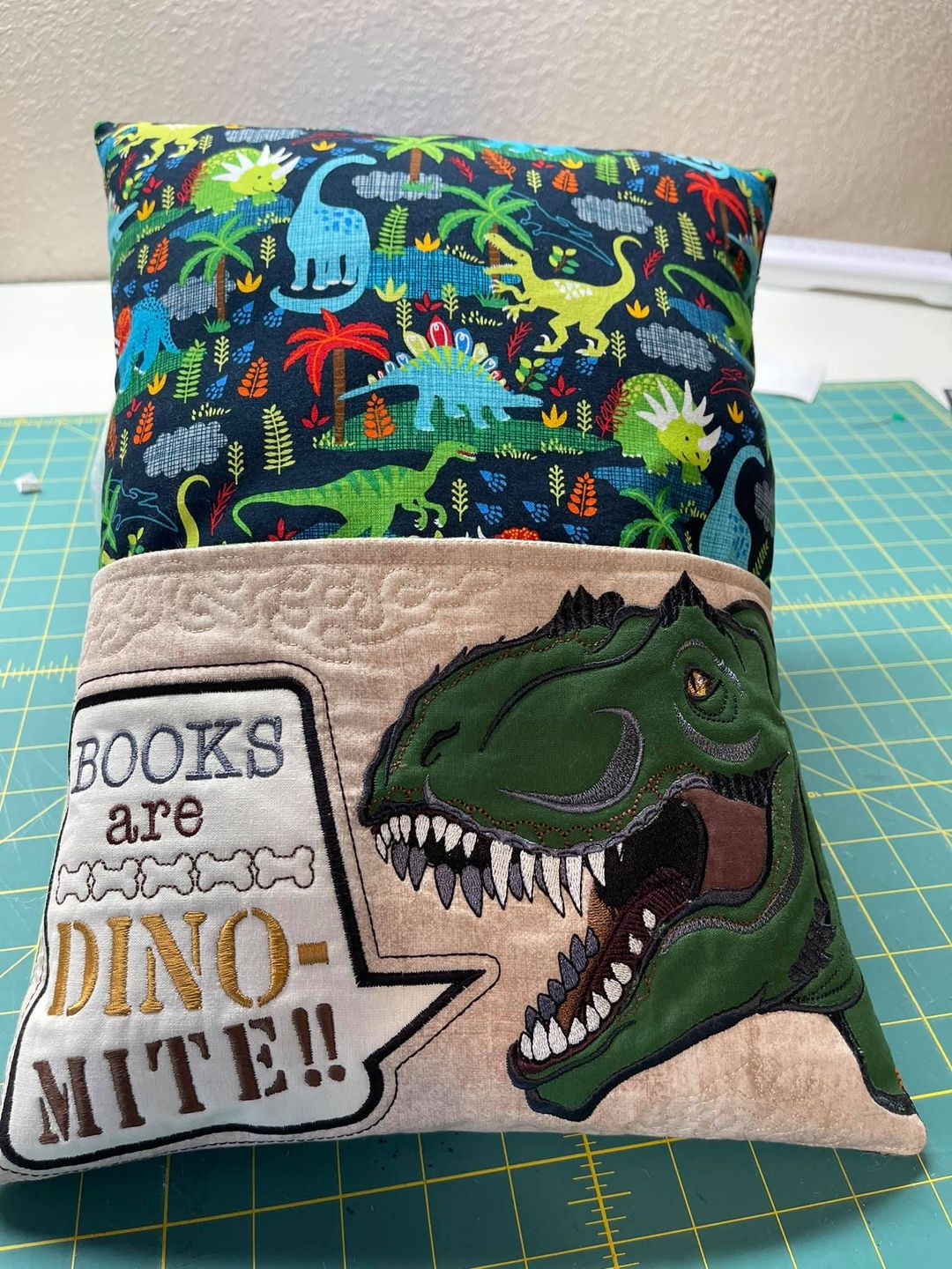 Dinosaur Reading Pillow in the hoop machine embroidery design