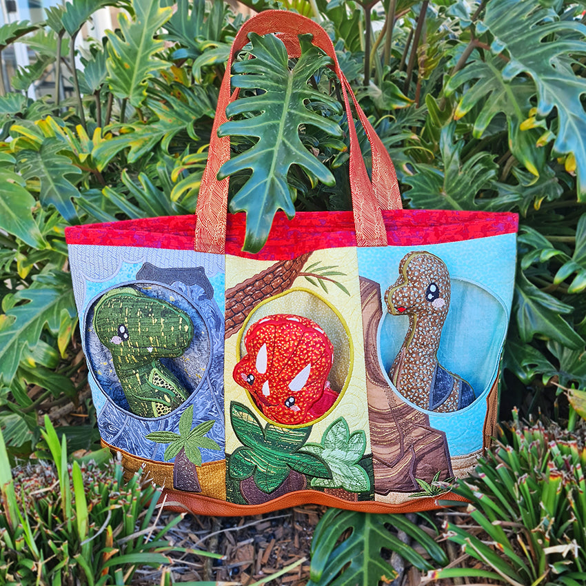 Dinosaur Pocket Bag 5x7 6x10 8x12 - Sweet Pea Australia In the hoop machine embroidery designs. in the hoop project, in the hoop embroidery designs, craft in the hoop project, diy in the hoop project, diy craft in the hoop project, in the hoop embroidery patterns, design in the hoop patterns, embroidery designs for in the hoop embroidery projects, best in the hoop machine embroidery designs perfect for all hoops and embroidery machines