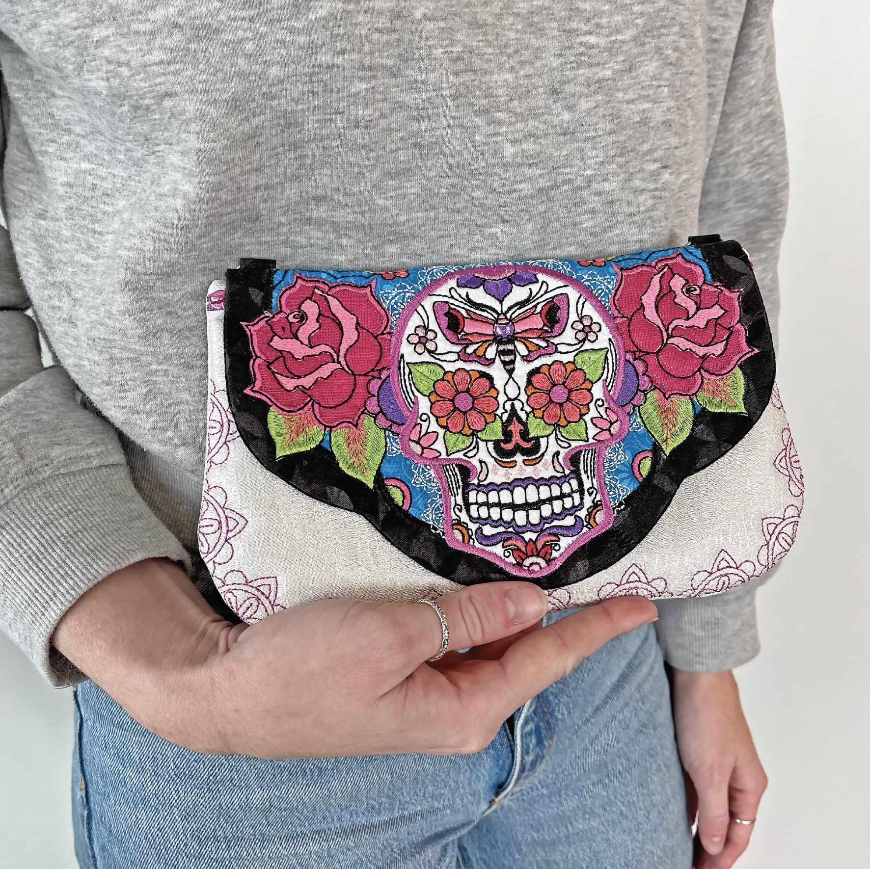 Sugar Skull Clutch with Zipper 5x7 6x10 7x12 9.5x14 - Sweet Pea Australia In the hoop machine embroidery designs. in the hoop project, in the hoop embroidery designs, craft in the hoop project, diy in the hoop project, diy craft in the hoop project, in the hoop embroidery patterns, design in the hoop patterns, embroidery designs for in the hoop embroidery projects, best in the hoop machine embroidery designs perfect for all hoops and embroidery machines